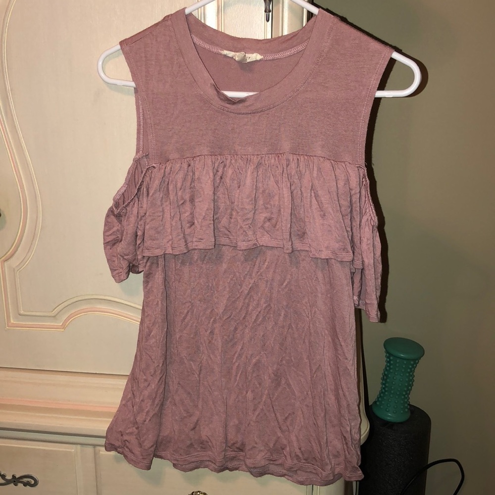 Pink flowy shirt with ruffles and shoulder cutouts